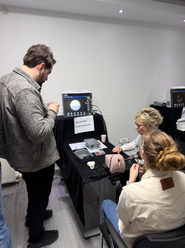 A group of people looking at a deviceAI-generated content may be incorrect.